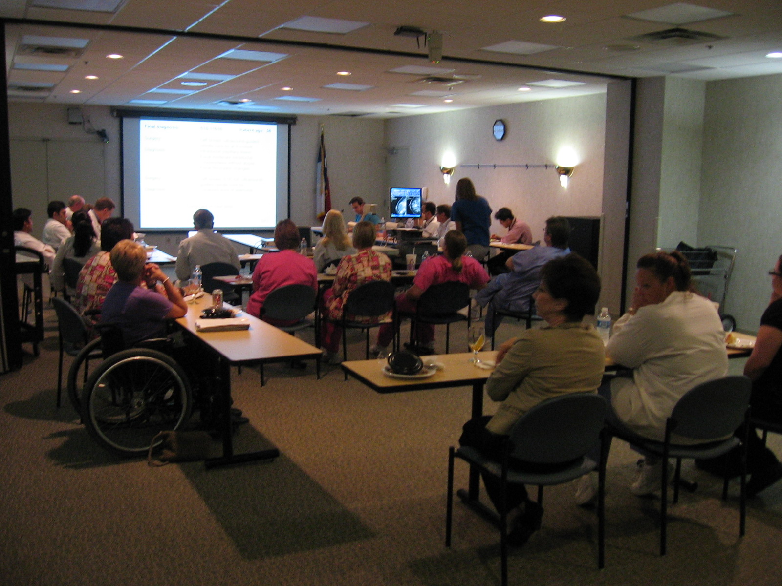 2001 photograph of our comprehensive breast conference held at Houston Northwest Medical Center hospital. In attendance are surgeons, medical and radiation oncologists, pathologists and mammographers. Also, present are key members of the breast support group. The equipment and presentation techniques have improved over the years. We are in our 22nd year as of 2018.